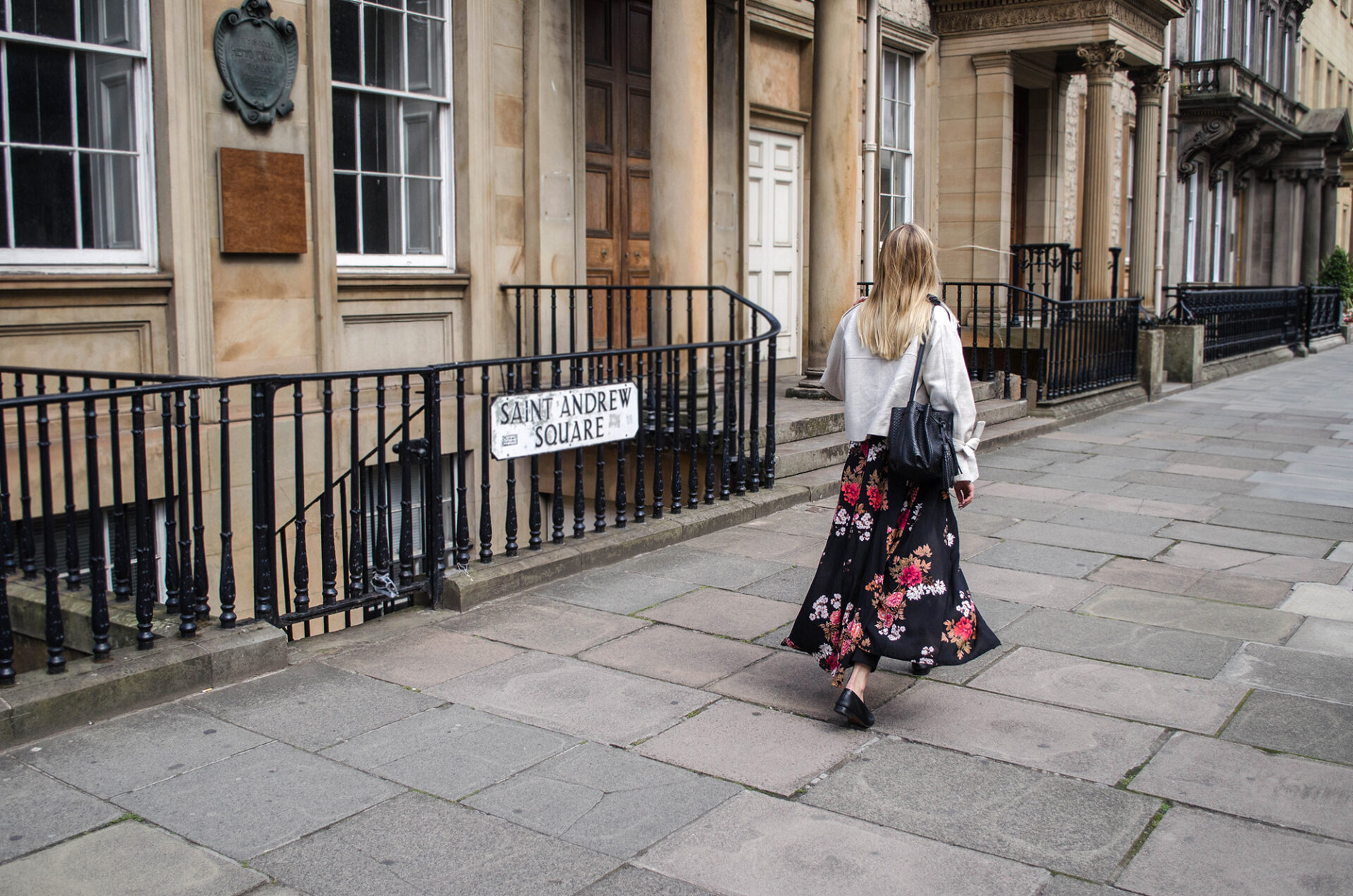 Girl in linen jacket- Chylak bag and floral maxi dress